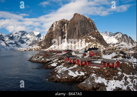 Traditional red wooden Rorbu fishermen`s huts in village of Hamnoy on Moskenesoya Island in Lofoten Islands in Norway Stock Photo